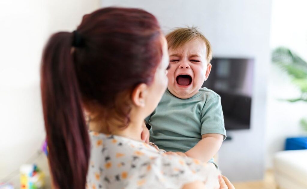 Baby crying and unwell.