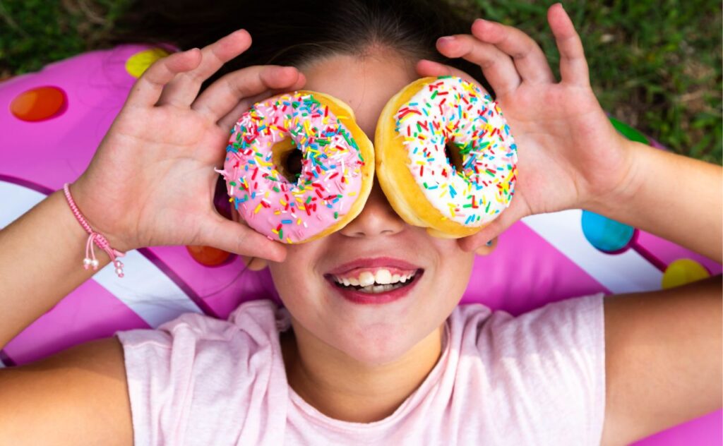 Too much sugar: Girl with donuts