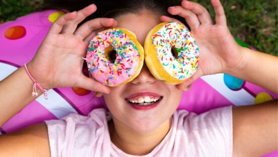 Too much sugar: Girl with donuts