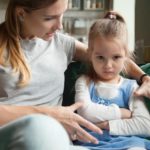 Mother trying to get toddler to listen at park