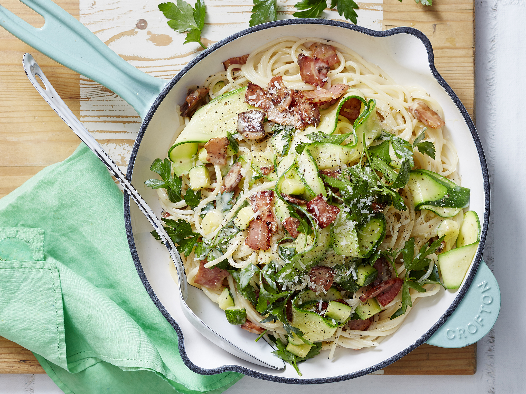 Grain spaghetti with bacon, zucchini and parmesan