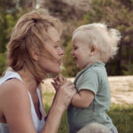 Baby smiling at mum