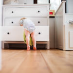 child friendly furniture - small child climbing into drawer