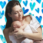 Mum sleeping with baby in bed