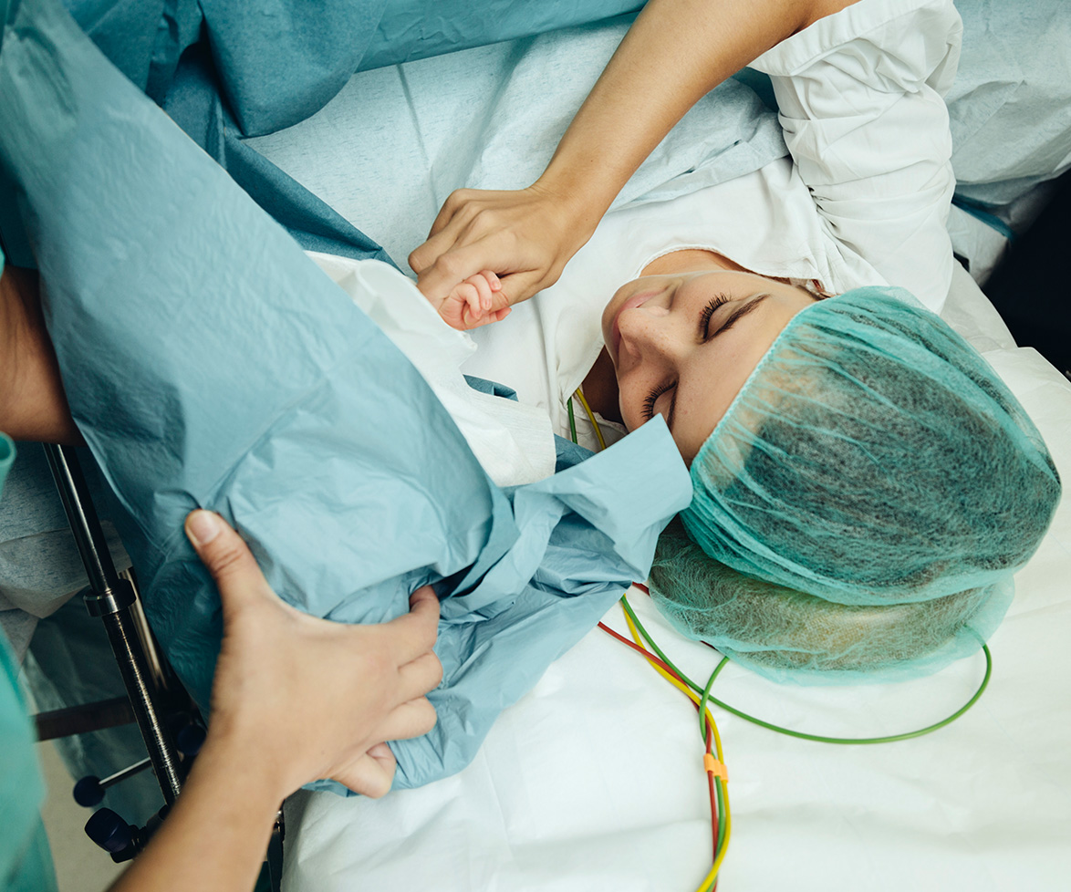 Mum delivers her son with her own bare hands via C-section