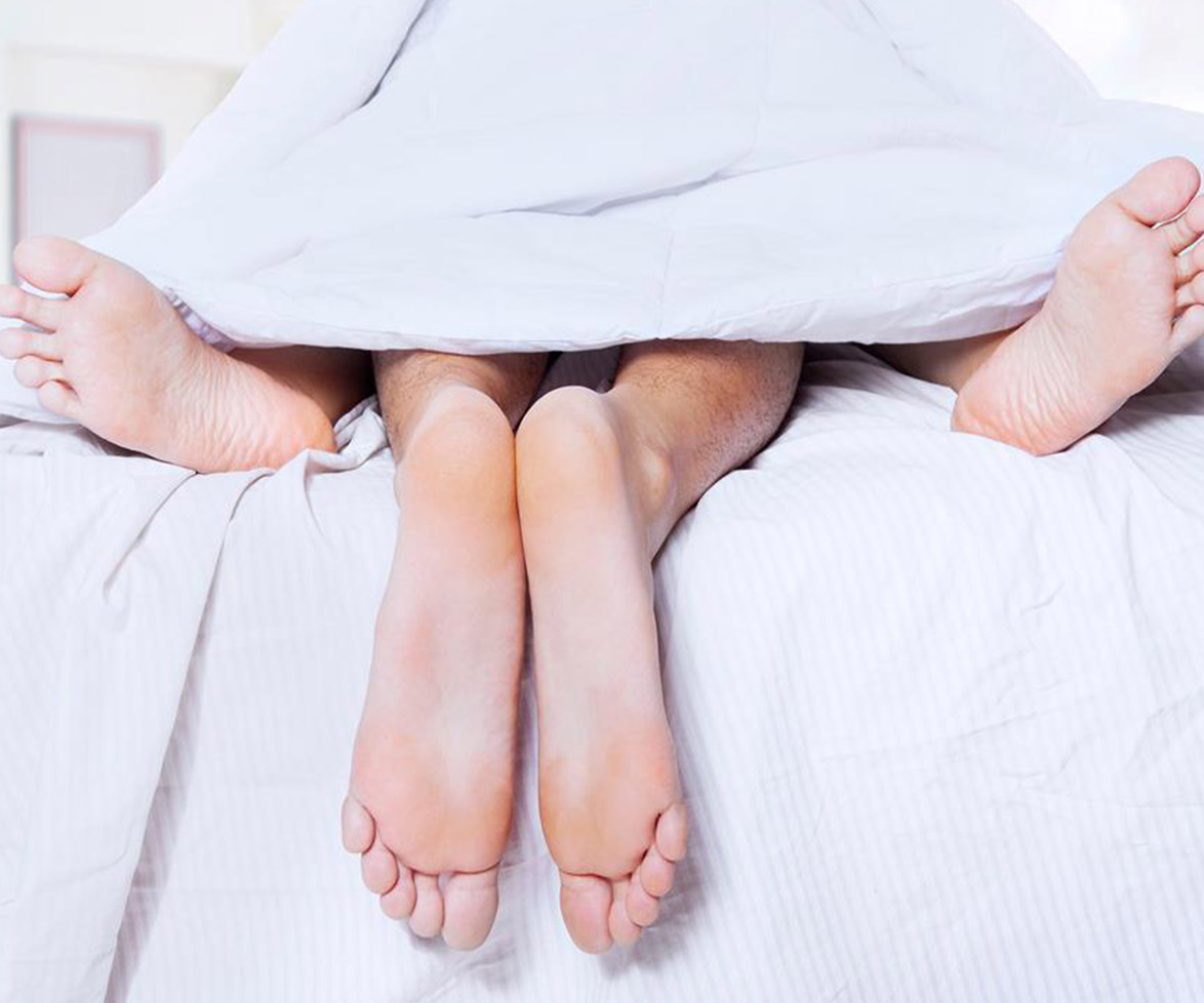 Man and woman in bed.