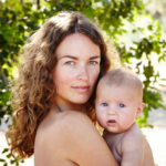 Mother and baby bare skin outdoors