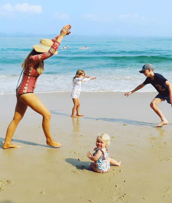 Carrie Bickmore, beach, family, cartwheel