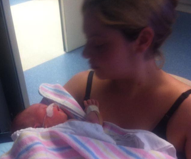 Mother at hospital with newborn.