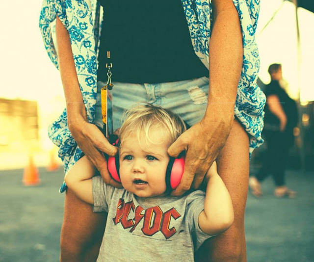 small child wearing headphones enjoying byron bay bluesfest
