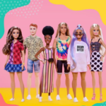 6 diverse Barbie dolls lined up against pink background