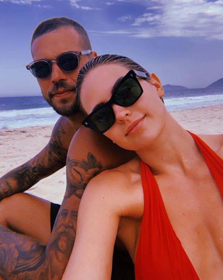 Jesinta and Buddy Franklin on the beach on a sunny day