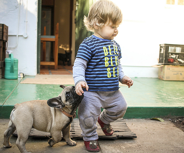 baby with puppy