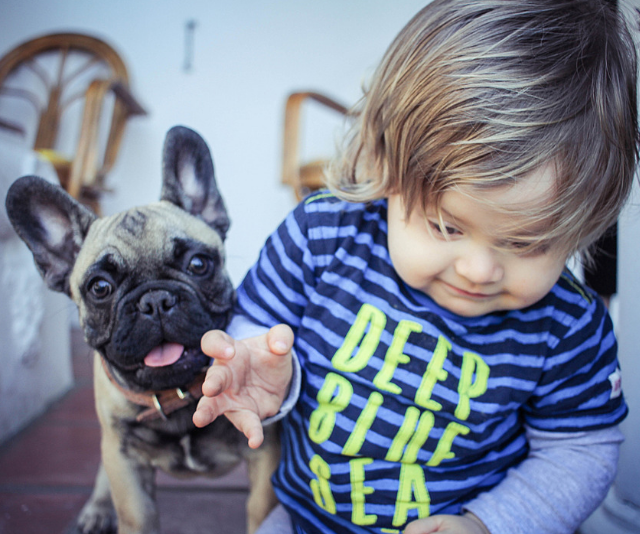 baby with puppy