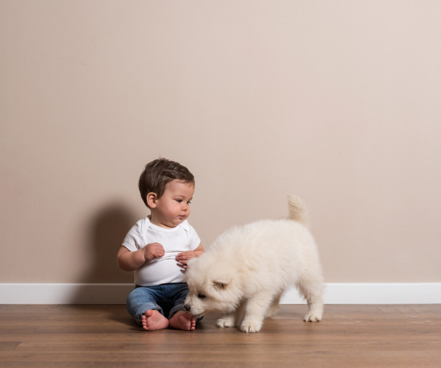 baby with puppy
