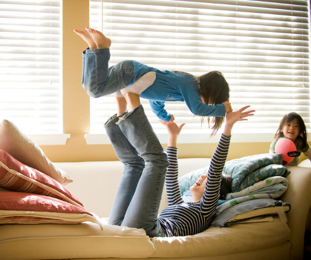 mum plays on lounge with children