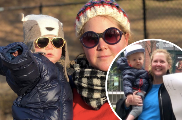 Amy Schumer and son hold up the sweetest handwritten sign while visiting her dad at a social distance