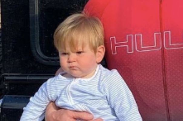 This adorable baby has inherited his famous dad’s scowl. Can you guess who it is?