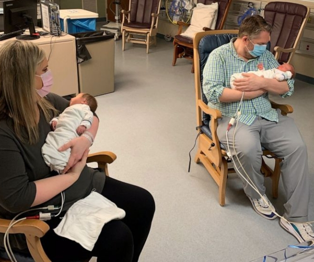 Parents who battled coronavirus finally meet their newborn twins 20 days after their birth