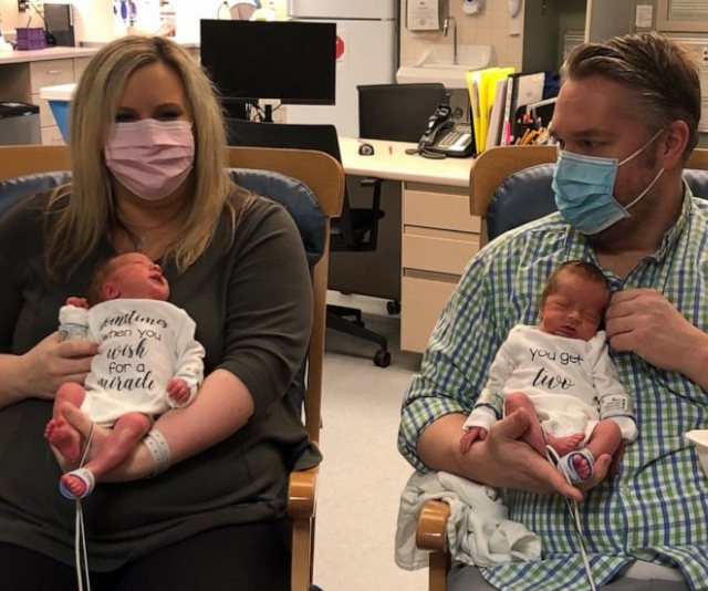 Parents who battled coronavirus finally meet their newborn twins 20 days after their birth