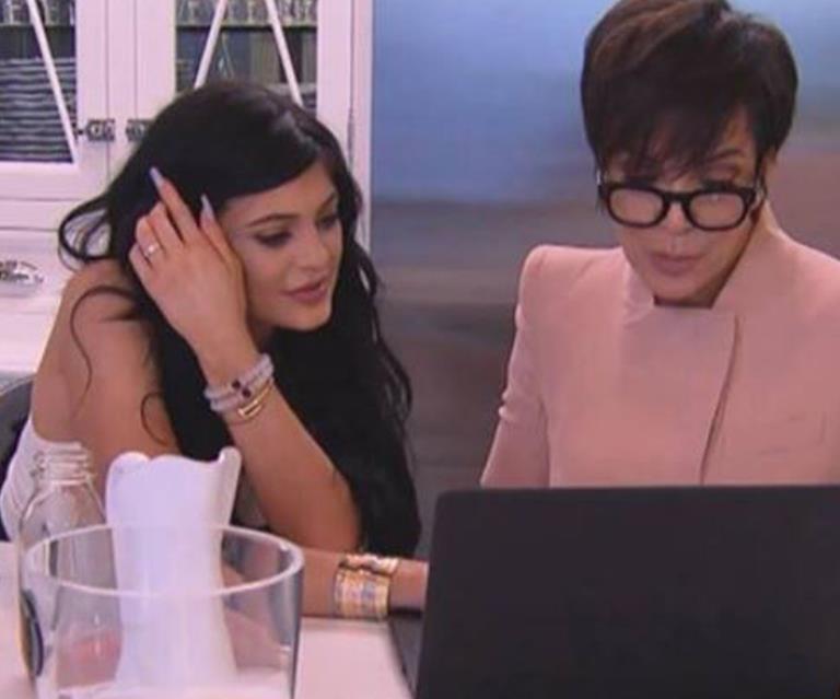 Kendall and Kris Jenner looking at a laptop screen