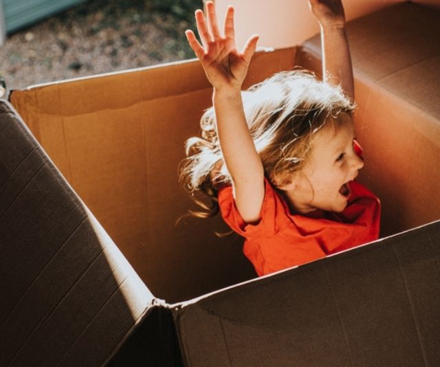 Kid in cardboard box