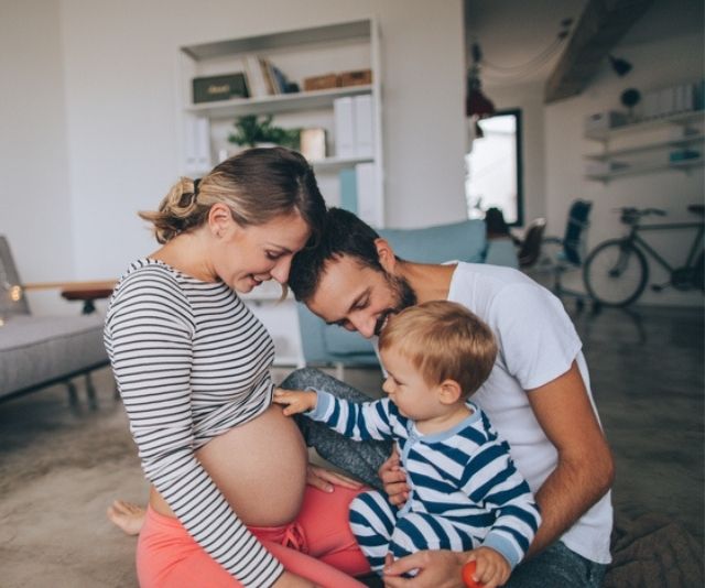 Pregnant mum and dad show baby bump to toddler