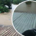 Flood crisis: Urgent calls for help as a pregnant woman is stuck on a roof as water levels rise