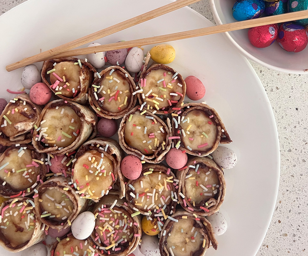 Nutella and Banana Sushi plated with Easter eggs