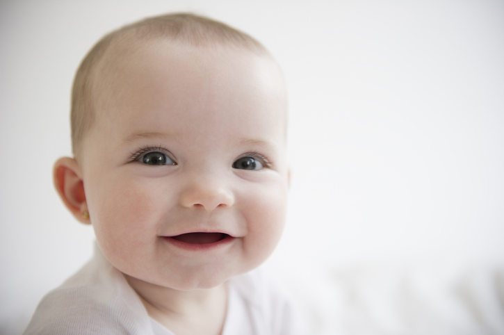 Close up of gummy baby smiling