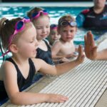 The benefits of swimming lessons and water safety skills your child needs to learn