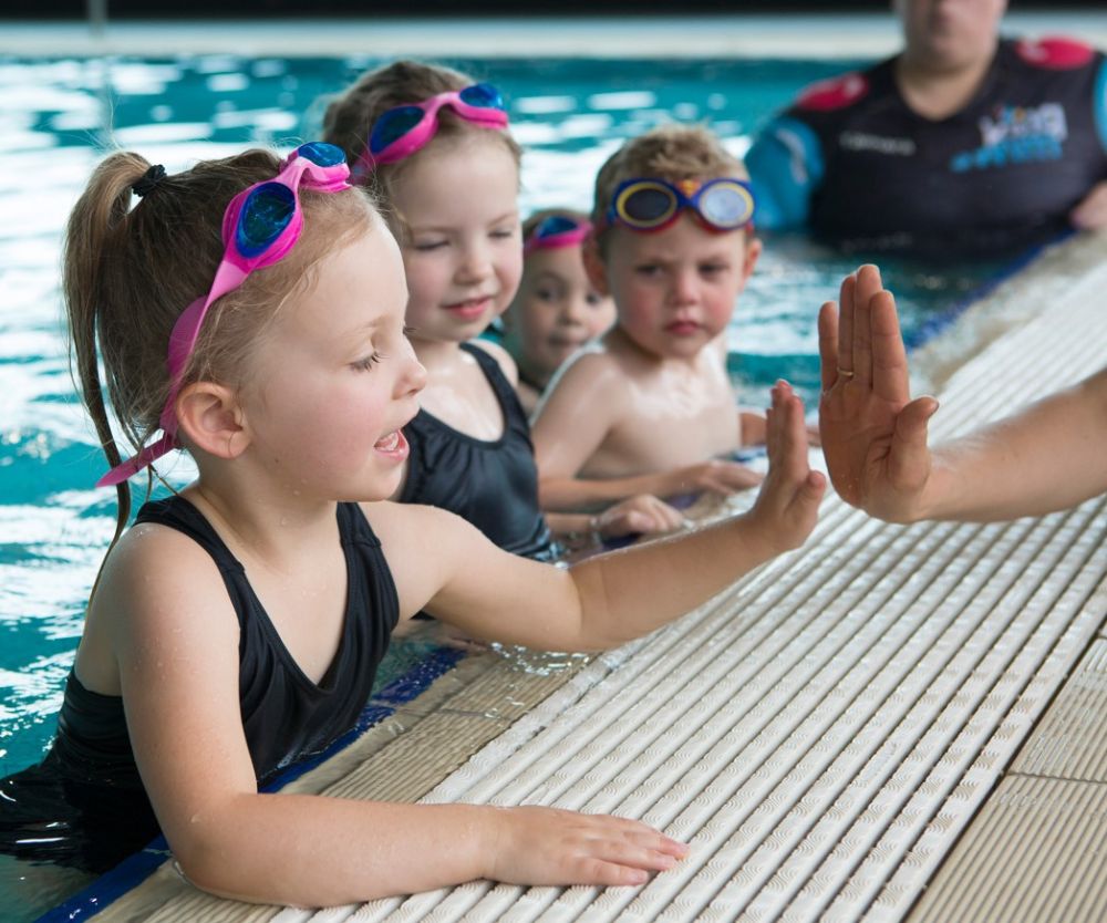 The benefits of swimming lessons and water safety skills your child needs to learn