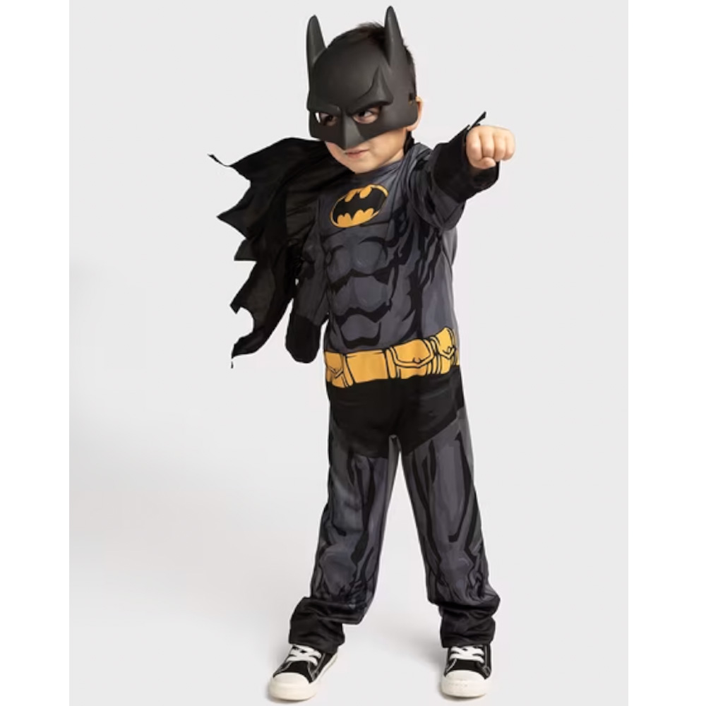 Small child wearing batman costume.