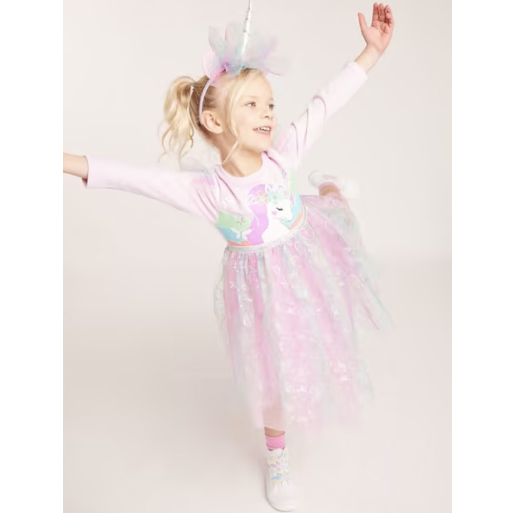 Small girl wearing unicorn fancy dress costume.