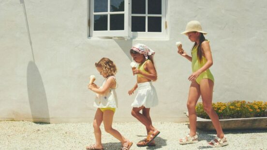 Billini Mini girls sandals: 3 girls wearing sandals walking in a line eating an ice-cream