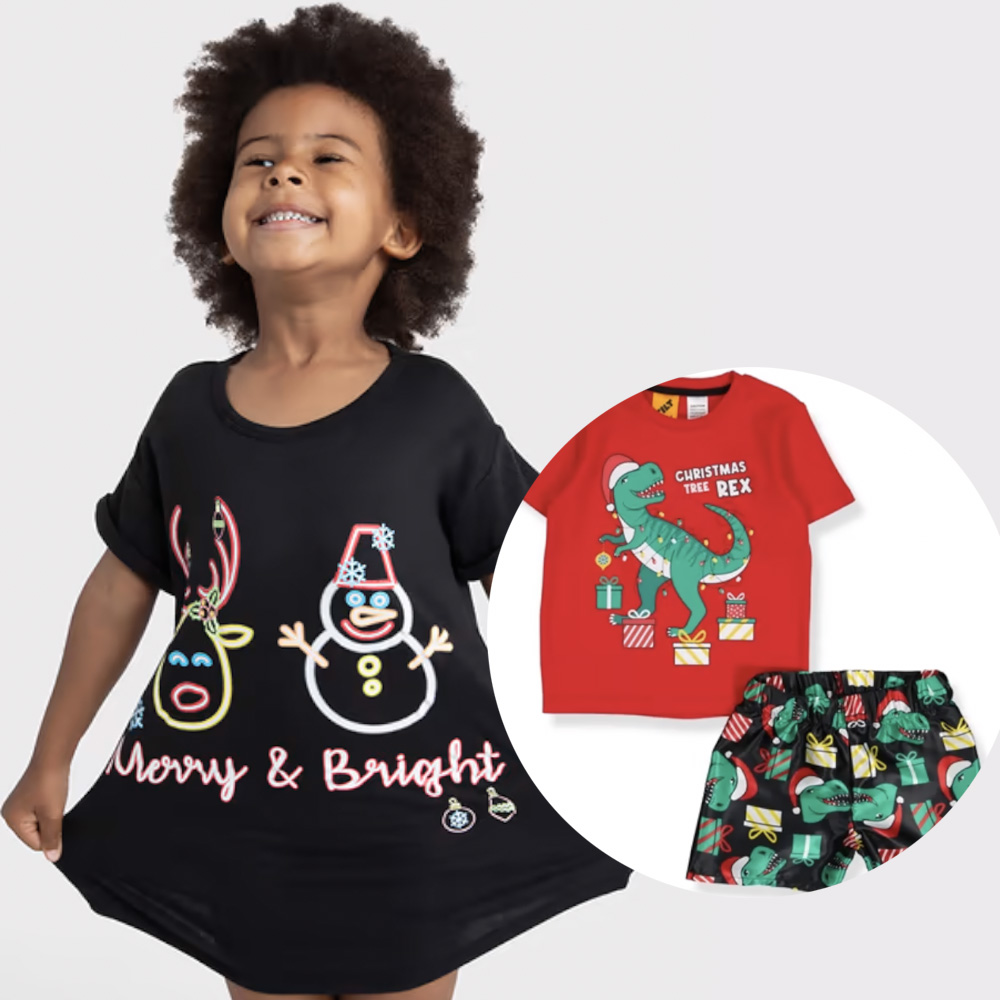 Little girl with black hair wearing a black Christmas nightie that says Merry and Bright, plus Xmas PJs with dinosaurs