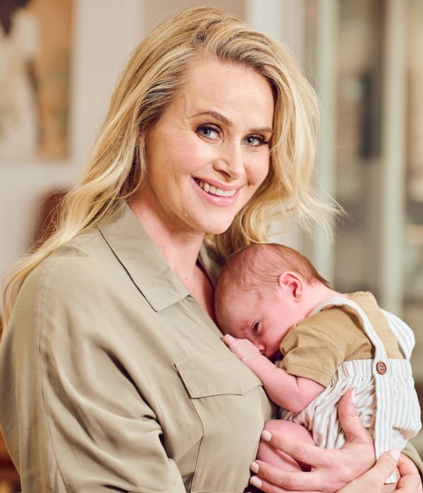 Kate DeAraugo holds newborn baby Hudson