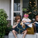Three kids opening Christmas presents Australia