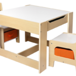 White and neutral wood kids table with two chairs, under-sear storage and a flip top with storage and a blackboard