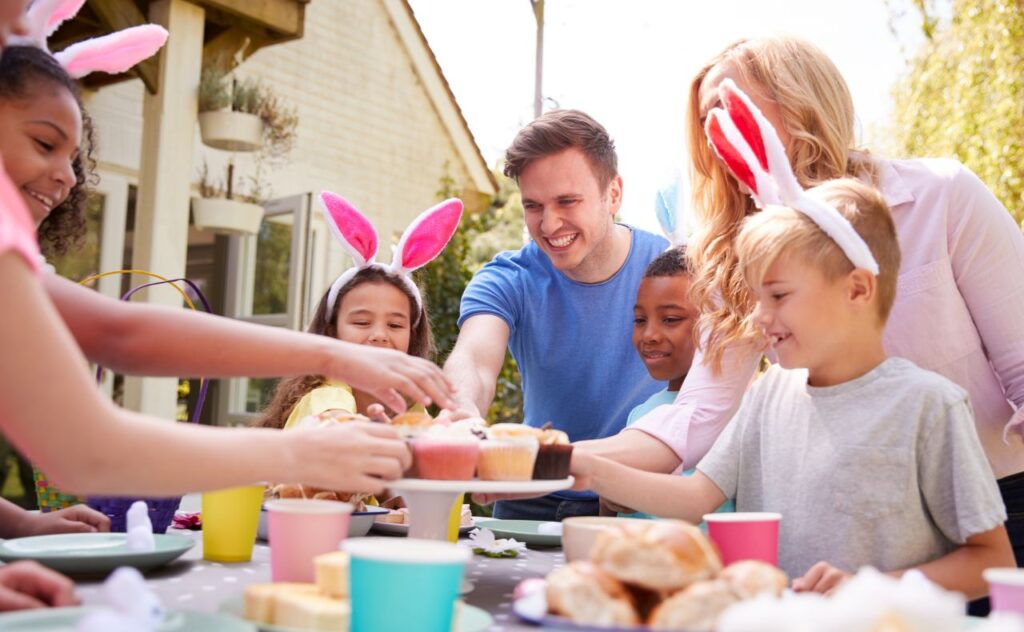 Family enjoying Easter lunch. Kids wearing bunny ears.