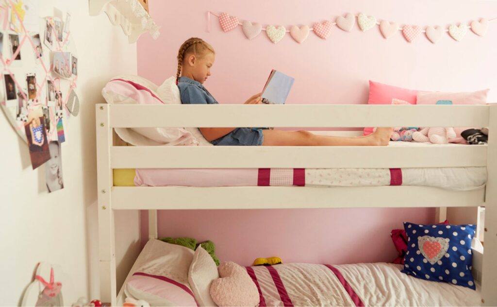 Bunk Beds Safety: Girl reading on top bunk