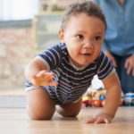 How does crawling help a baby develop?