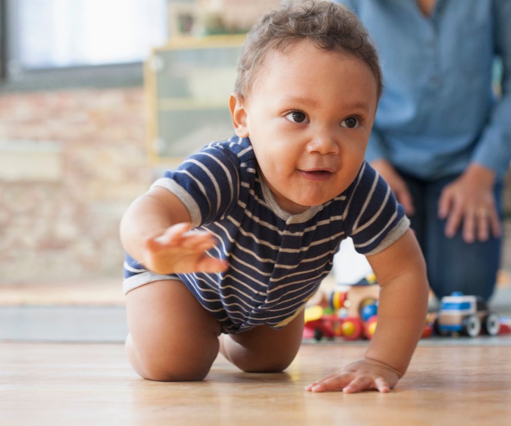 How does crawling help a baby develop?