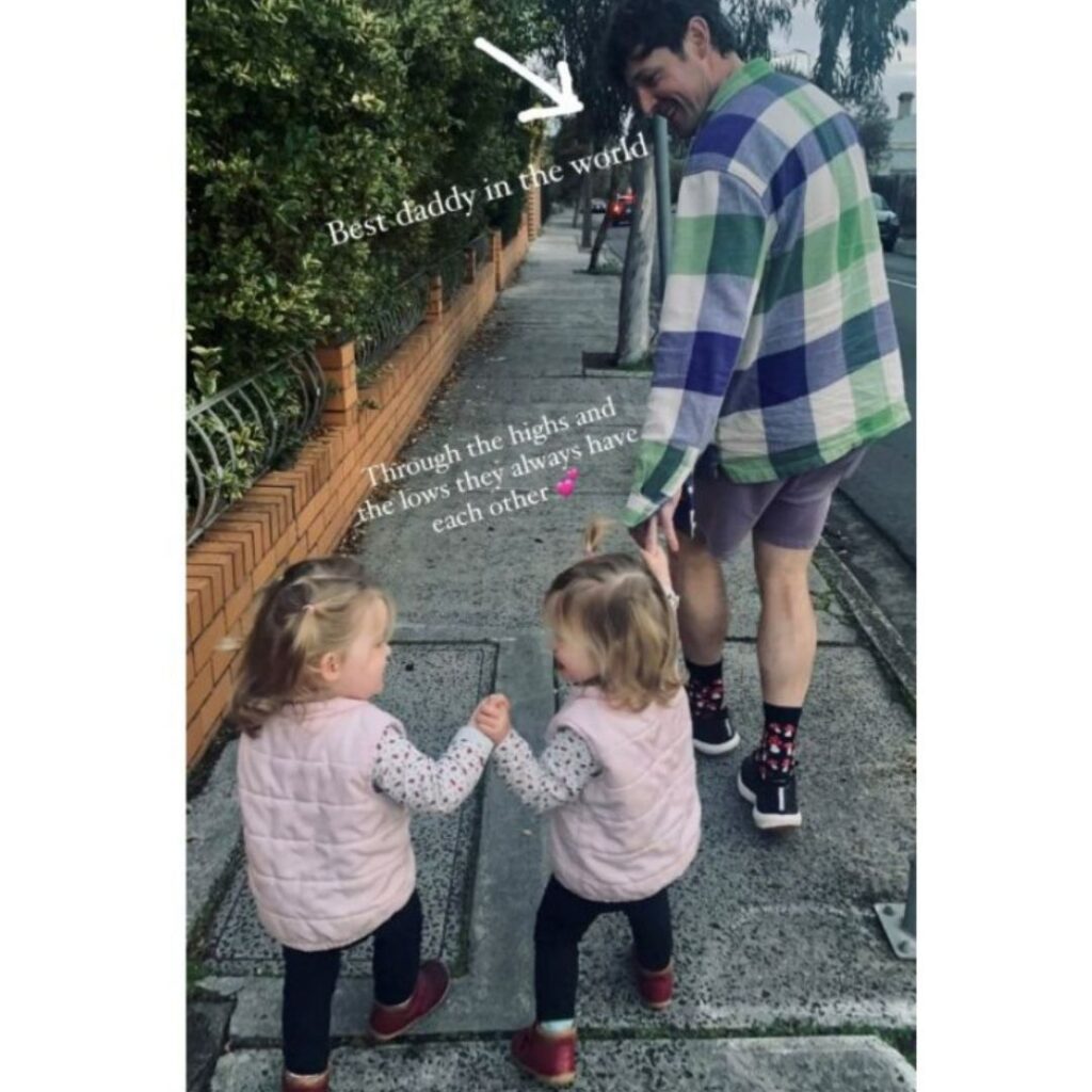 Lachy Wiggle Gillespie walking with his twin girls