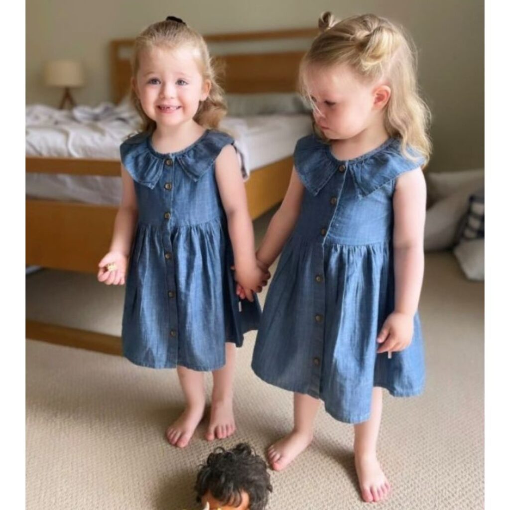 Lulu and Lottie in matching denim dresses