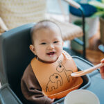 No more clean-up chaos: 10 silicone baby bibs that make mealtime easy