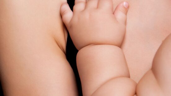 Close of chubby baby wrist and hand