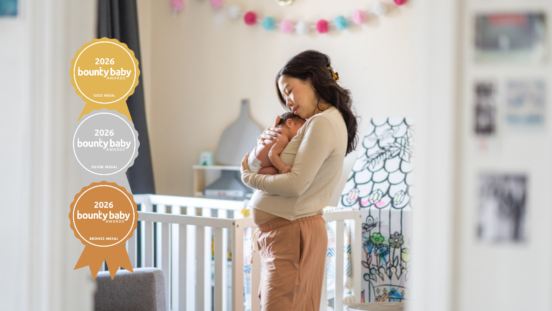 Best baby sleep aid or accessory. Mother with newborn in nursery