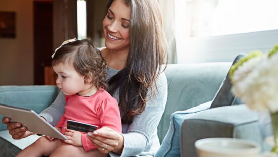 Mother online shopping with baby