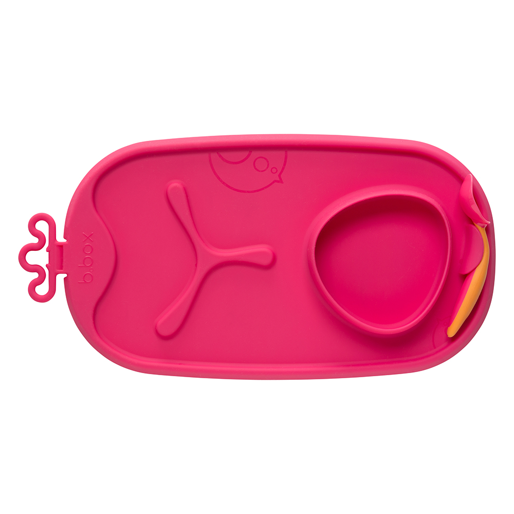 b.box roll + go mealtime mat  in bright pink with an orange and pink spoon